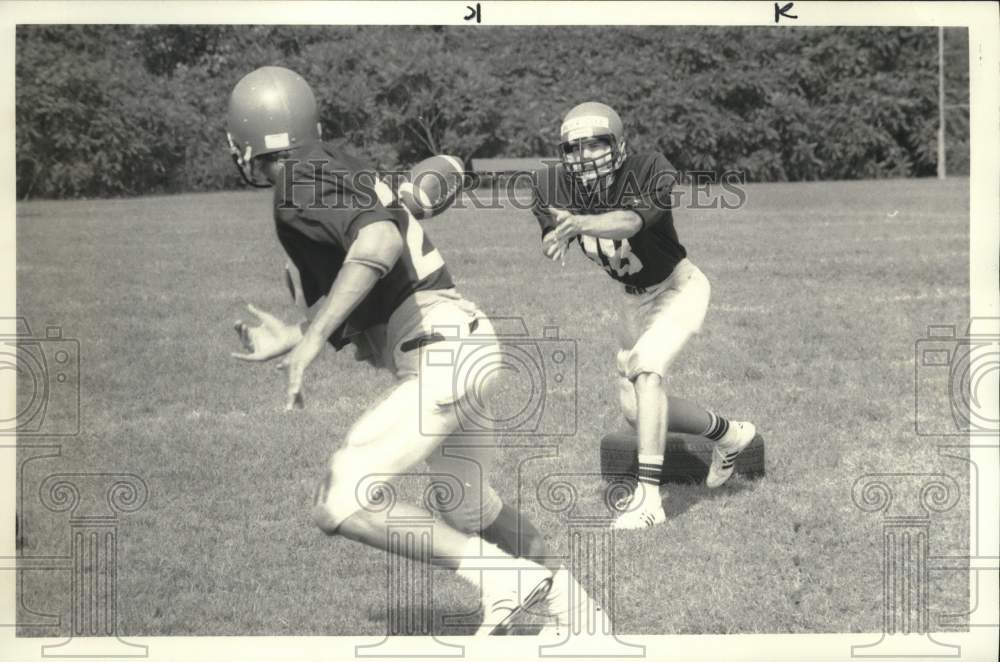 1985 Press Photo Baldwinsville Football Player Mike McKeigue with Todd Kasimir- Historic Images