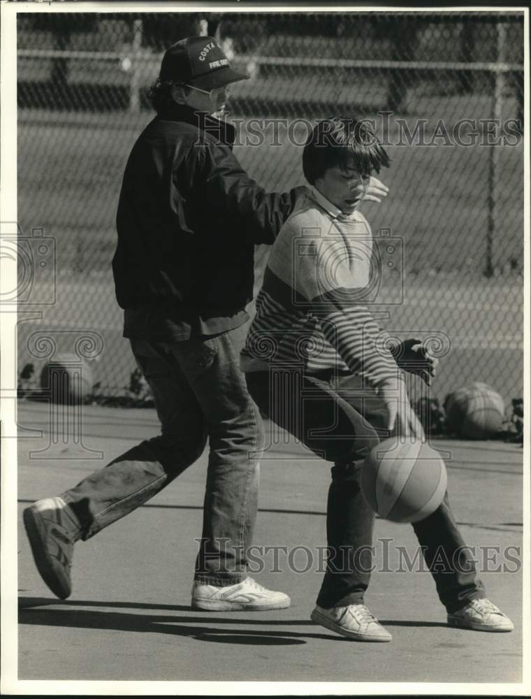 1987 Press Photo Jason Coleman and Joe Depew at MaChesney Park Basketball Court- Historic Images