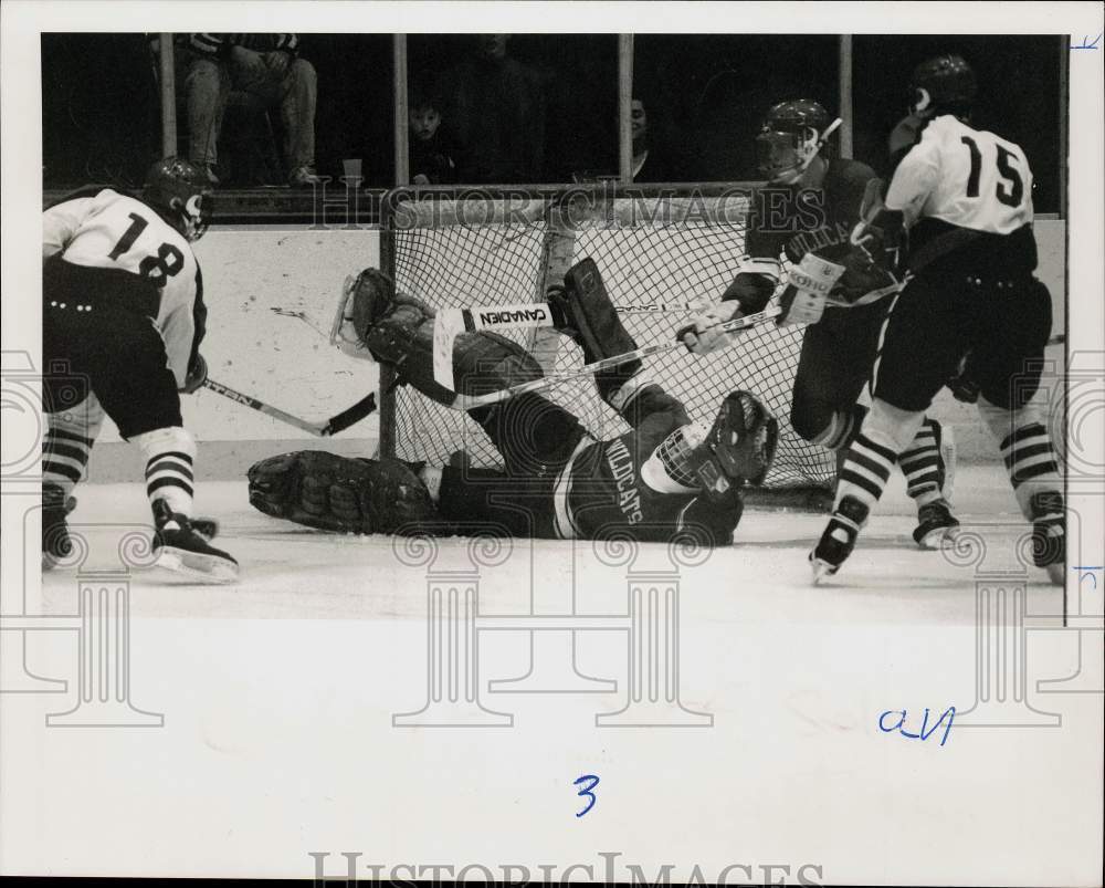 Press Photo Goalie down at net during West Genesee hockey game action.- Historic Images