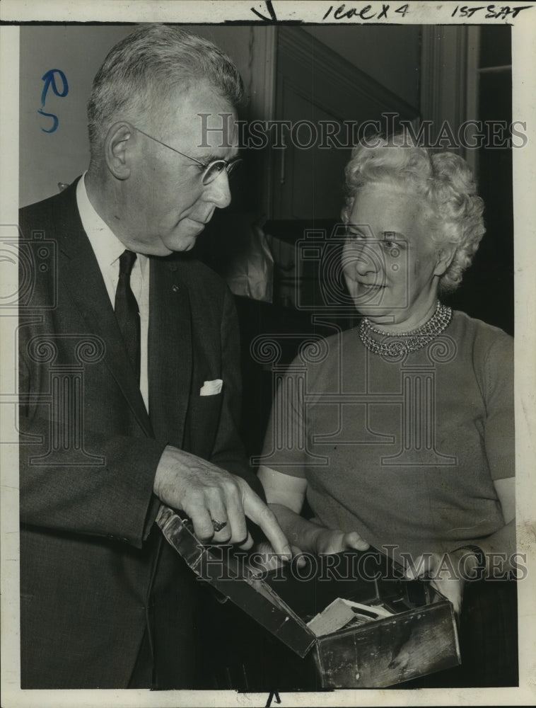 Load image into Gallery viewer, 1964 Press Photo Albany, NY attorney examines strongbox forced open in burglary
