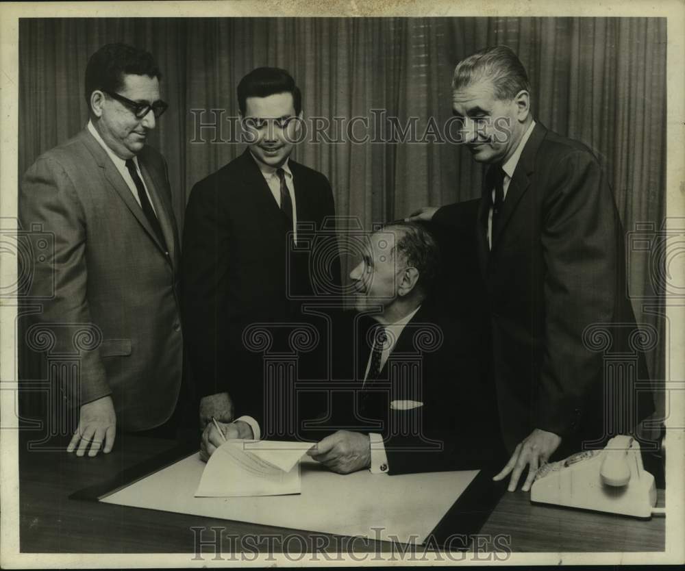 1964 Press Photo J. Myer Schine and others around desk - tua12347- Historic Images