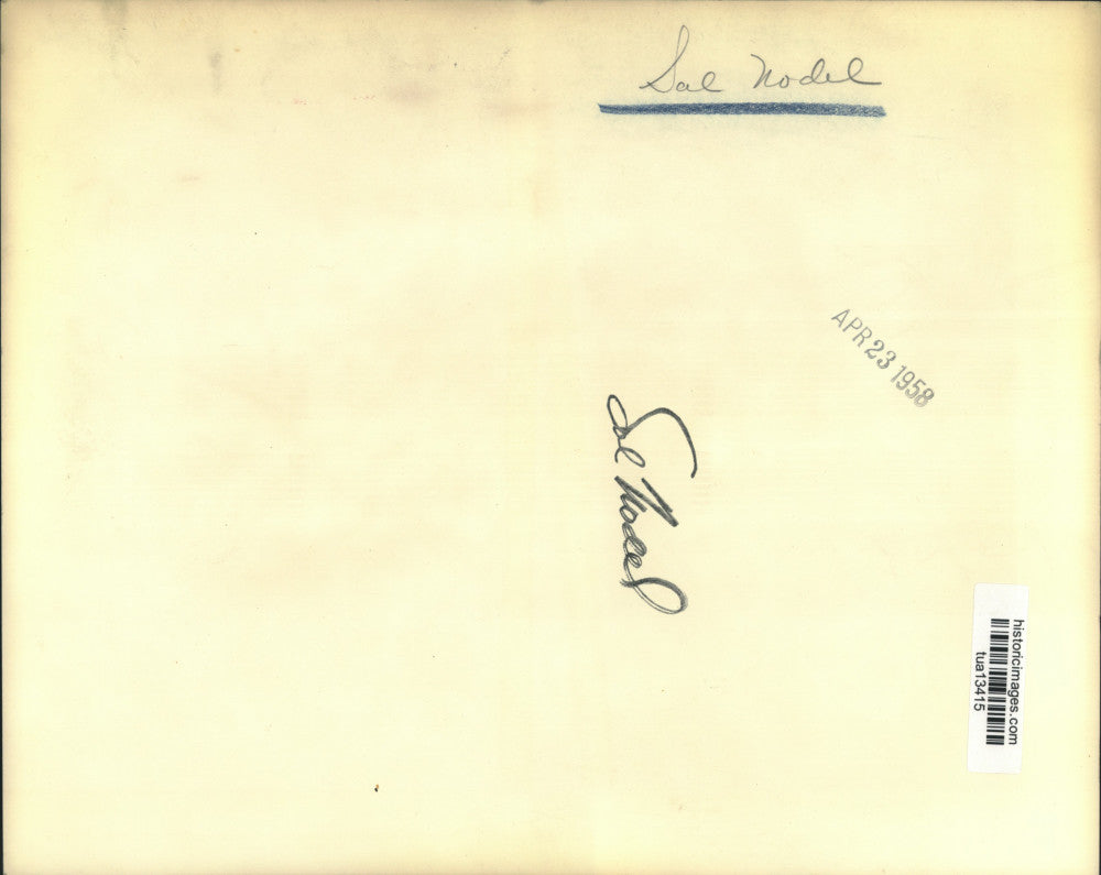 1958 Press Photo Sal Nodel stands in front of painting - tua13415