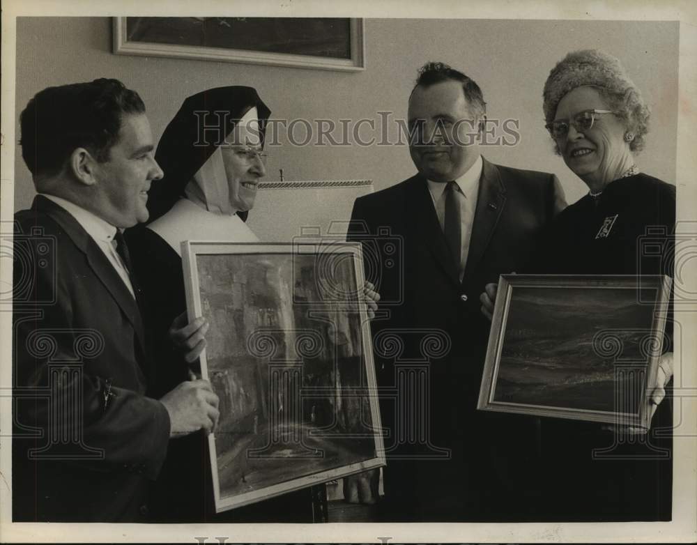 1963 Press Photo Dr. Mildred M. Allen, artist, presents paintings to St. Rose- Historic Images