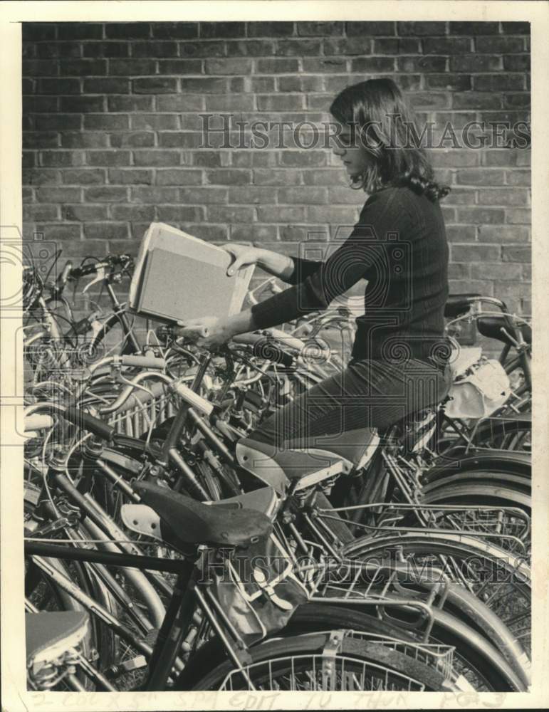 Press Photo Ann Osborn, freshman at Skidmore College, heads for class on bicycle