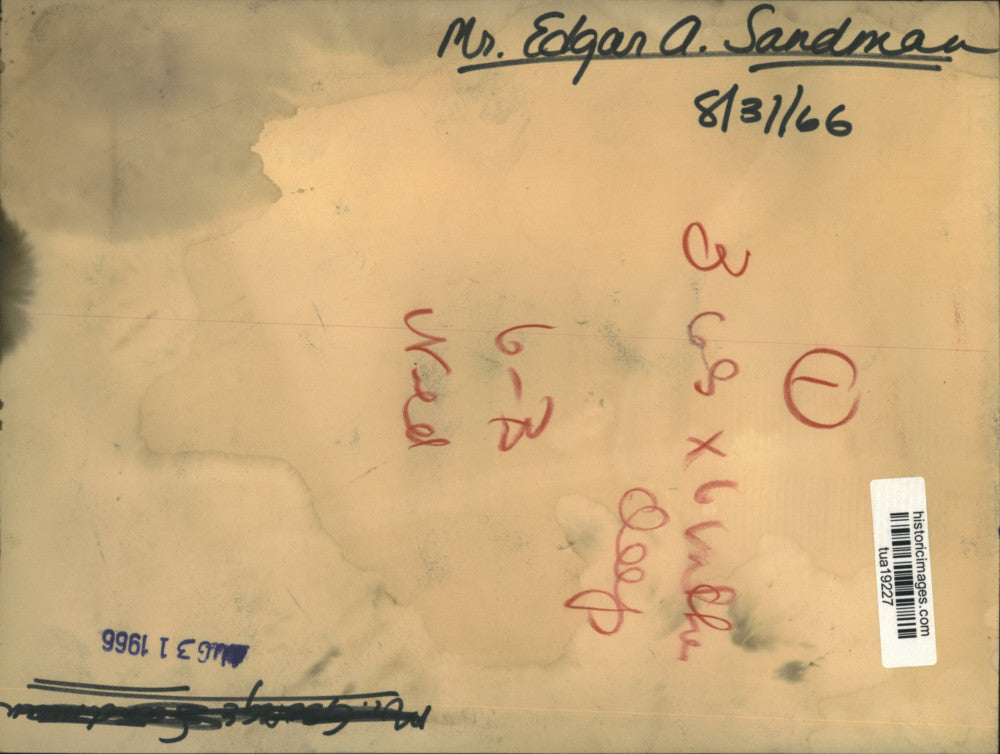 1966 Press Photo Edgar A. Sandman sits by pool with wife and son at resort