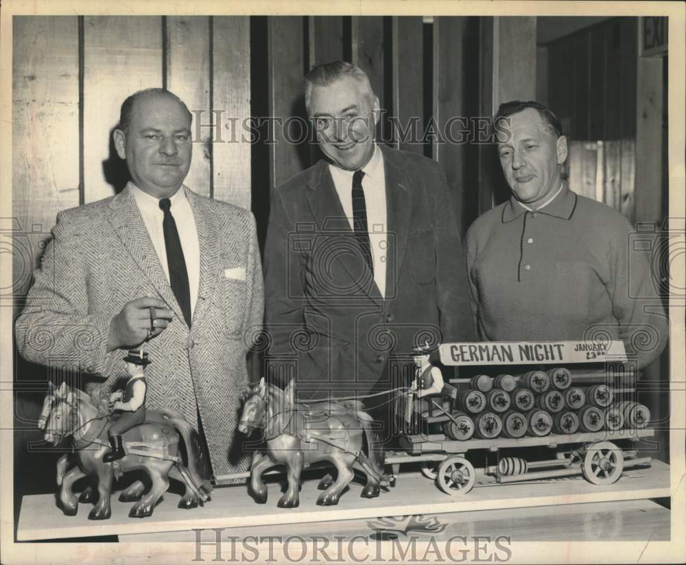 1965 Press Photo Group shows off model of German brewery wagon in New York