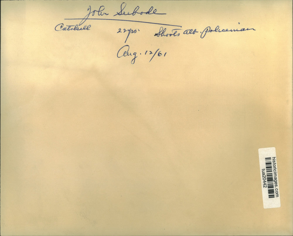 1961 Press Photo John Seebode, 22, Catskill, NY is handcuffed by police officer