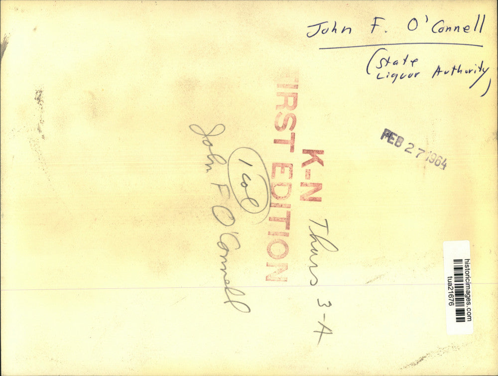 1964 Press Photo John J O'Connell, State Liquor Authority, looks over notebook