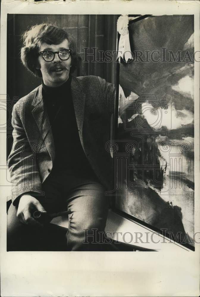 1969 Press Photo Jack O'Connell sits next to his painting at exhibit in Albany