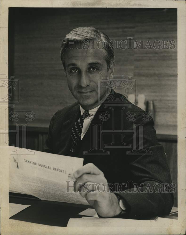 Load image into Gallery viewer, 1966 Press Photo Howard J Samuels sits behind desk and reads papers - tua21986
