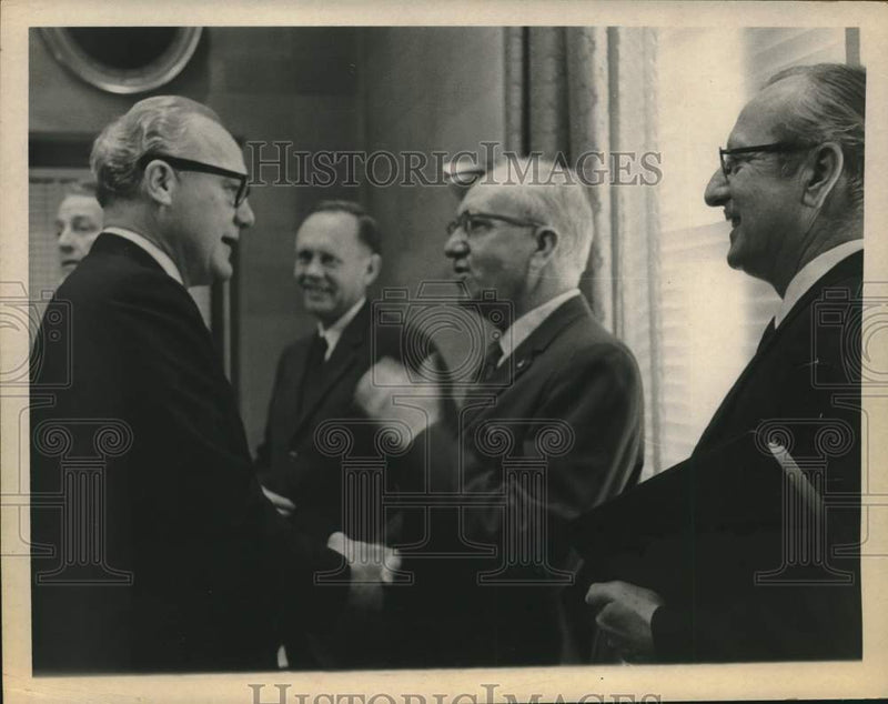 Load image into Gallery viewer, 1969 Press Photo Commissioner of Education Ewald Nyquist shakes hands with men
