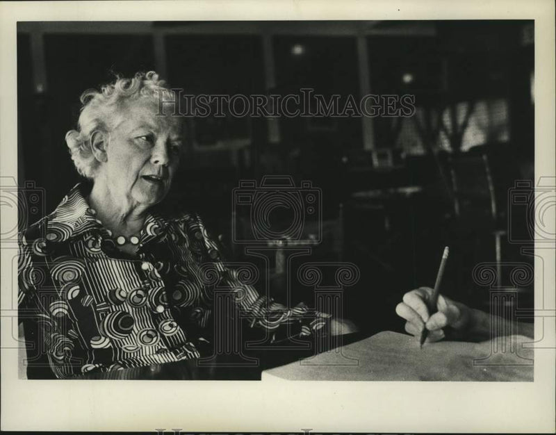 Load image into Gallery viewer, 1976 Press Photo Harriet Naylor sits and talks with person (not in view)
