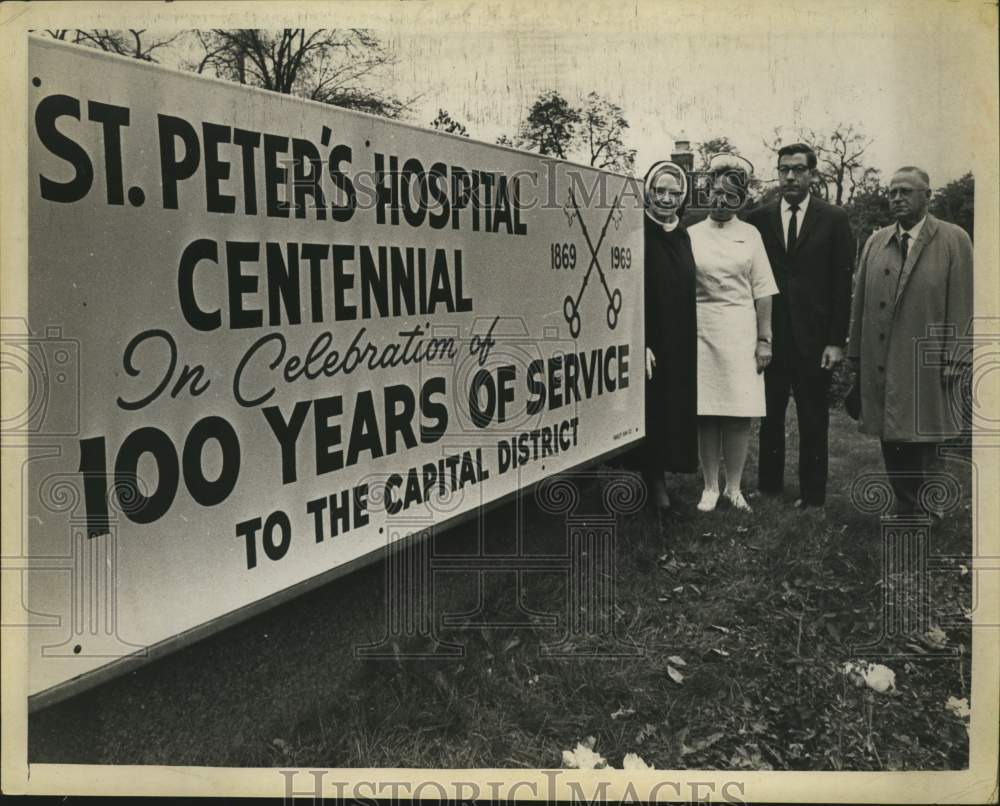 1969 Press Photo St. Peter's Hospital officials with centennial sign, Albany, NY