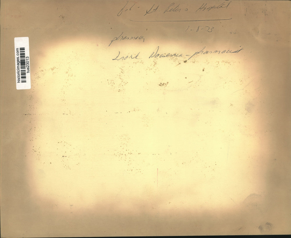 1973 Press Photo Pharmacist Frank Dosennia looks at prescription at St Peter's