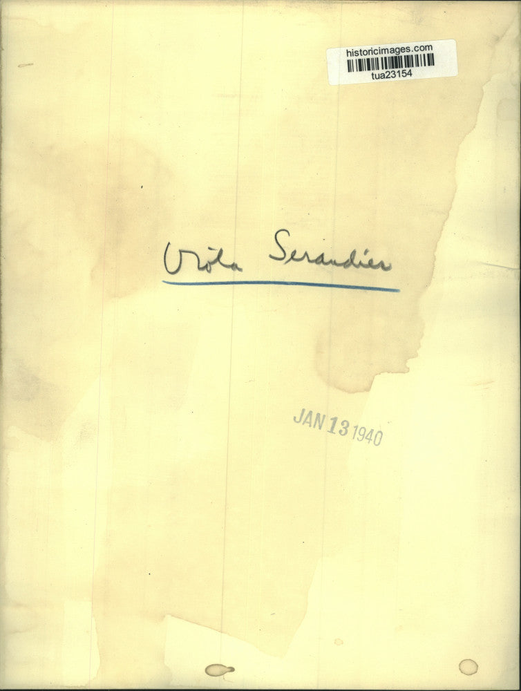 1940 Press Photo Viola Serandies rests head in hand as she sits at desk