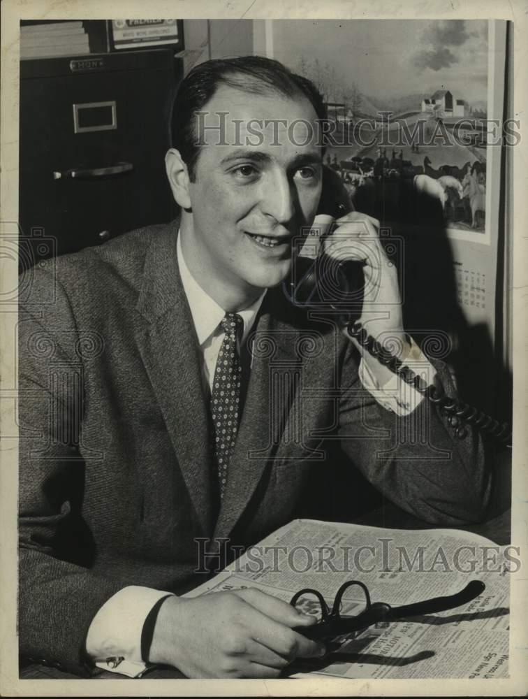 1963 Press Photo Del Sette sits at his desk talking on the telephone - tua23437