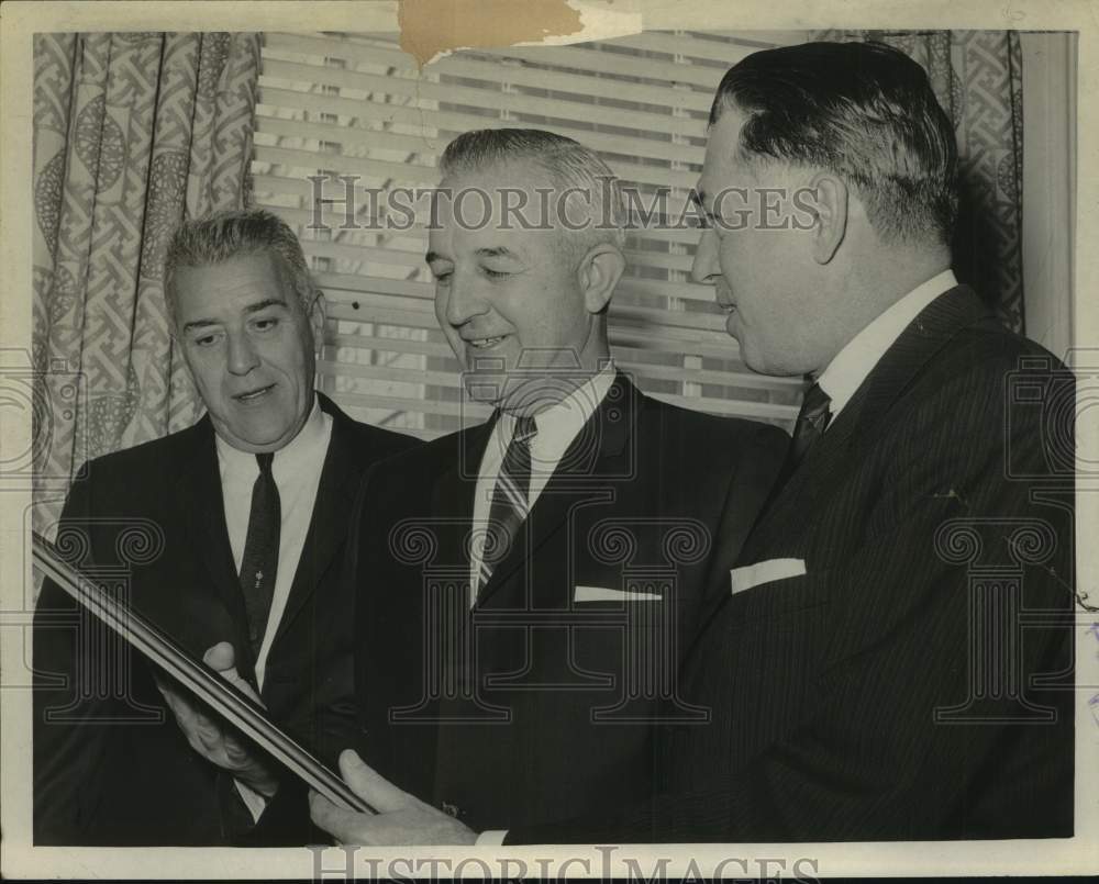 1966 Press Photo Dr Edward J Sabol (C) looks over award at luncheon with others