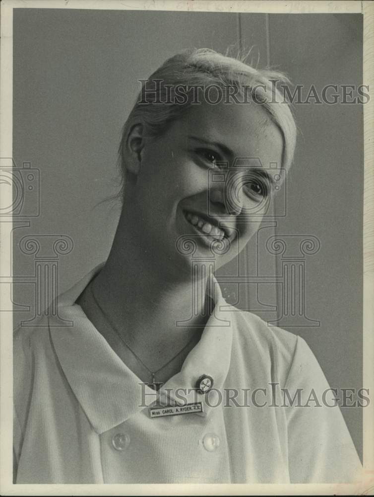 Load image into Gallery viewer, 1969 Press Photo Carol A Ryder, RN, smiles for photo in her nursing uniform
