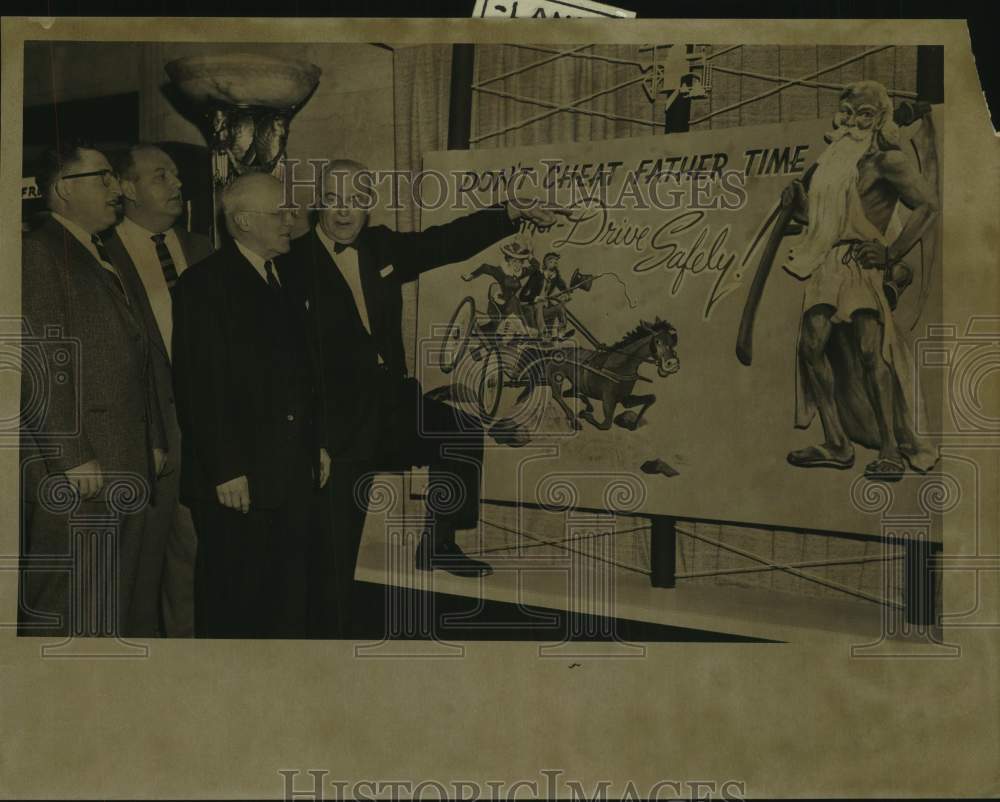 1959 Press Photo 4 men look at poster reminding people to drive safely