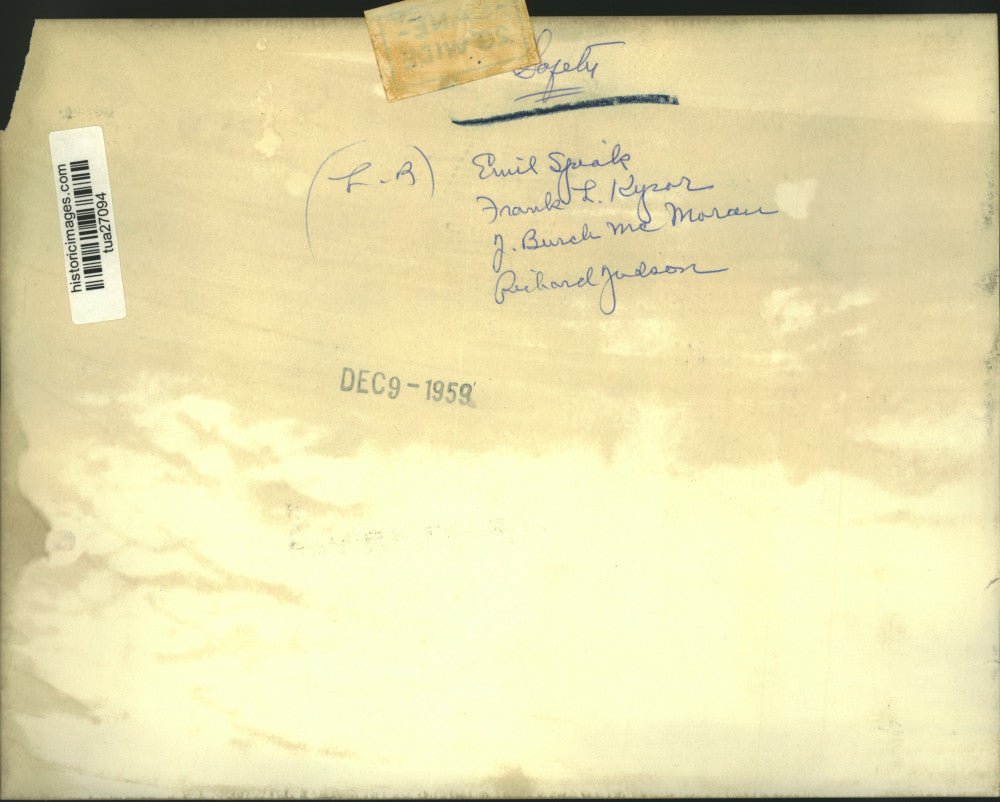 1959 Press Photo 4 men look at poster reminding people to drive safely