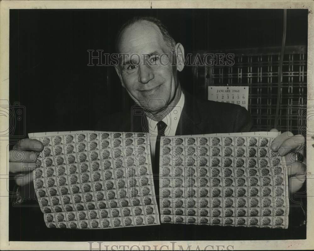 1968 Press Photo John Schumaker with sheets of stamps in Albany, New York