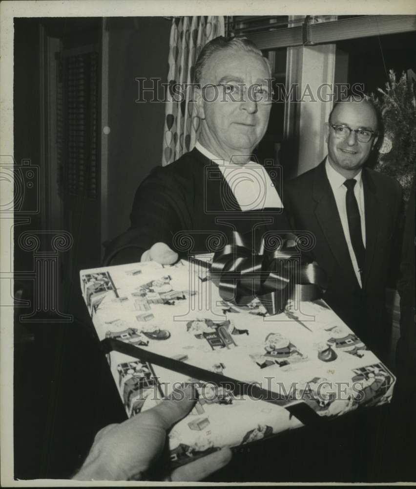 1961 Press Photo Brother Paul, Director of CBA, receives Christmas gift