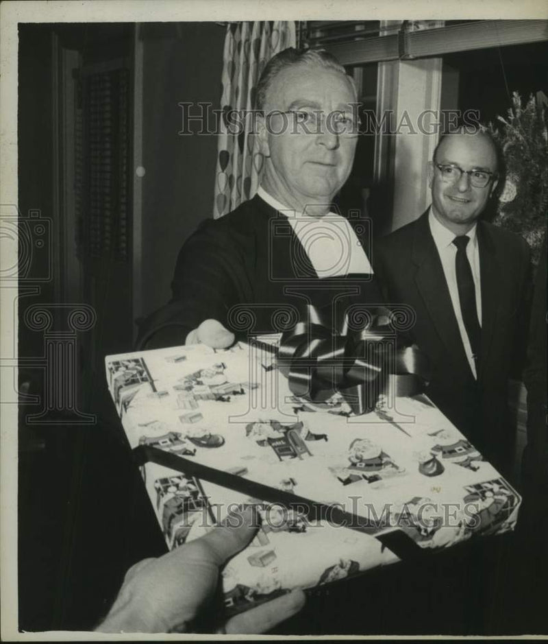 Load image into Gallery viewer, 1961 Press Photo Brother Paul, Director of CBA, receives Christmas gift
