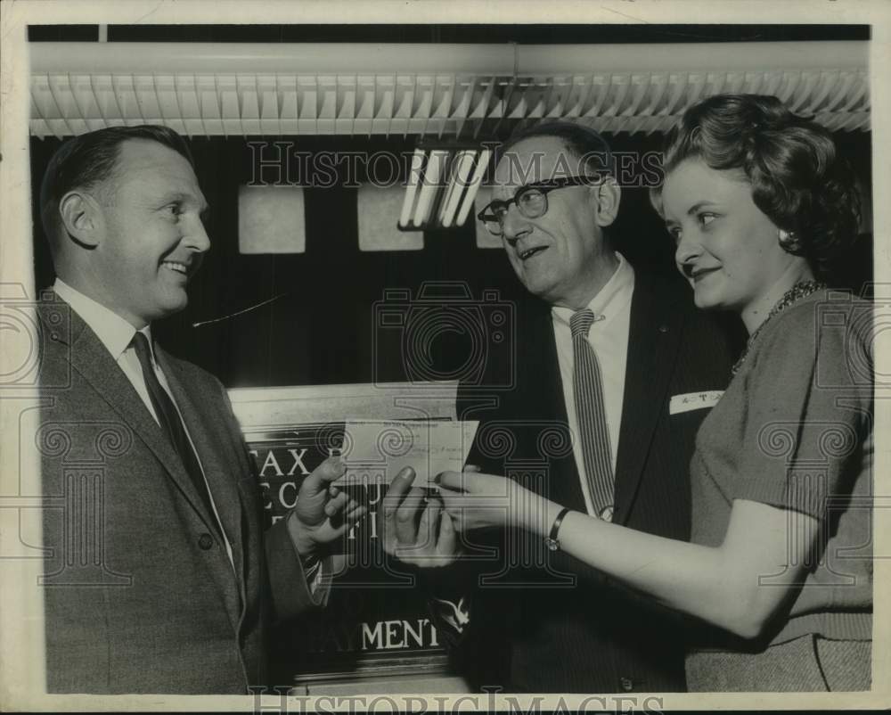 1961 Press Photo New York Telephone Company officials pays taxes in Albany