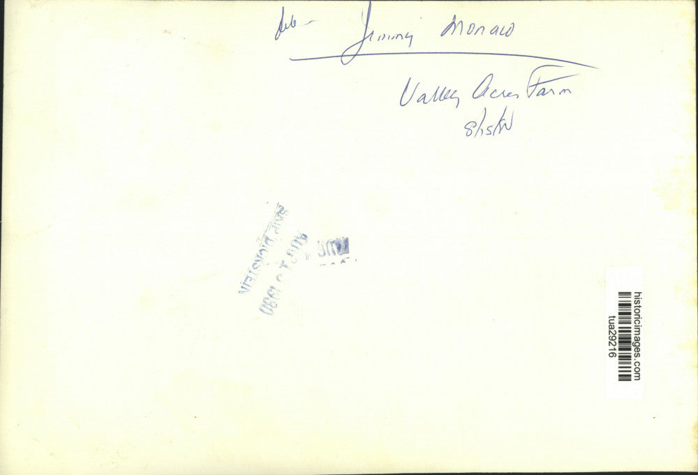 1980 Press Photo Jimmy Monalo stands next to produce at Valley Acres Farm