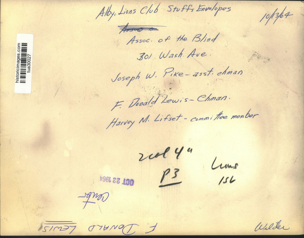 1964 Press Photo F Donald Lewis stuffs envelopes for Association of the Blind