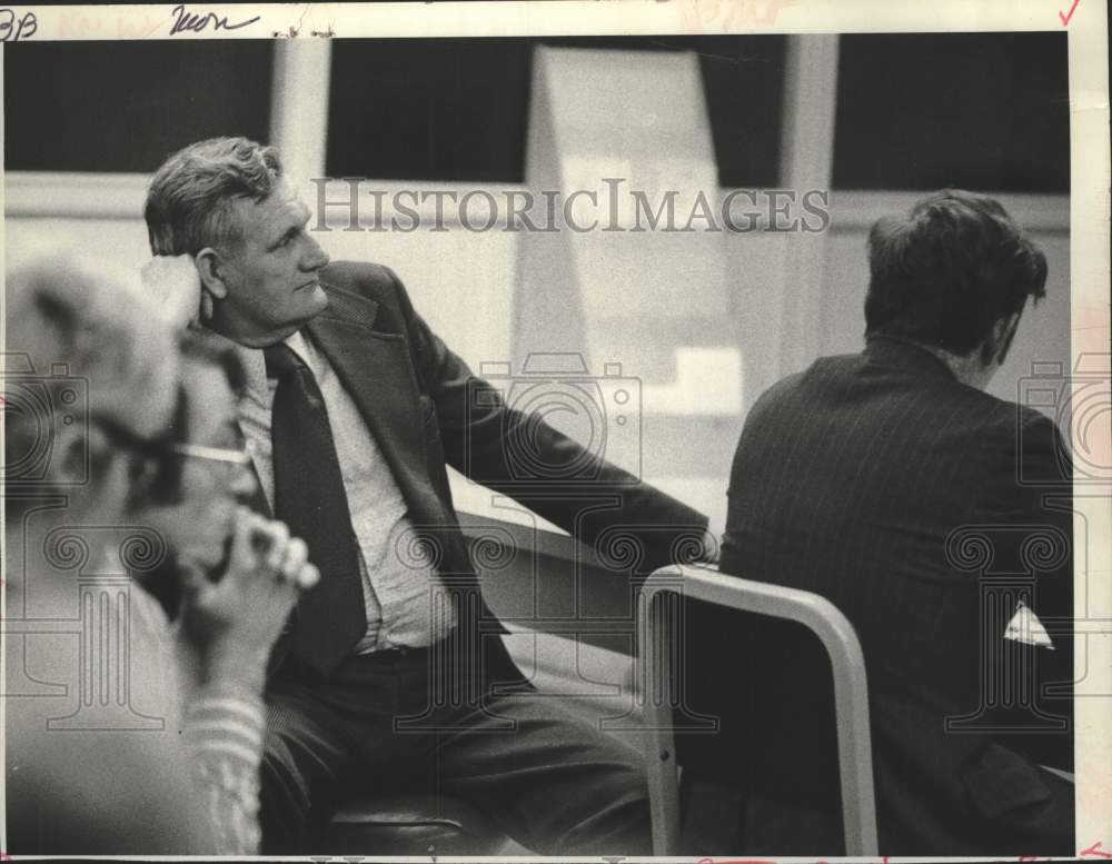 1973 Press Photo Edward O Lewis leans back on chair as he listens at a meeting