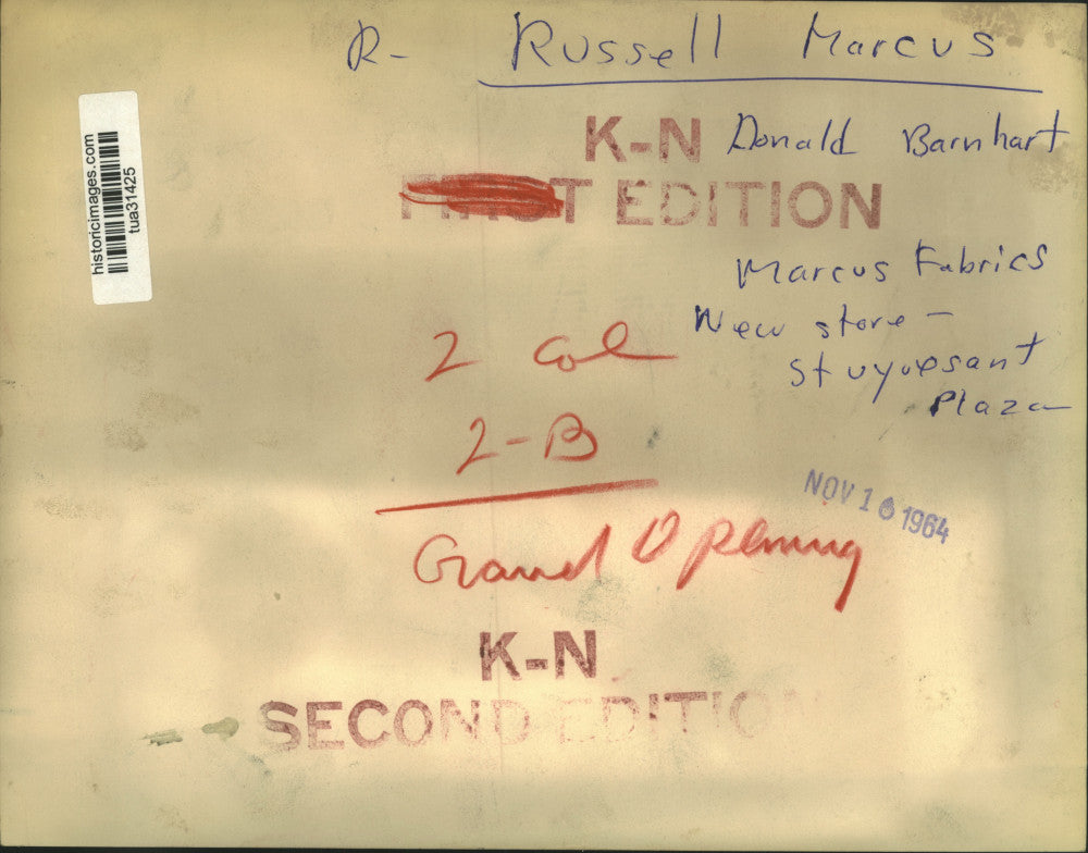 1964 Press Photo Donald Barnhart & Russell Marcus look at fabrics in Stuyvesant