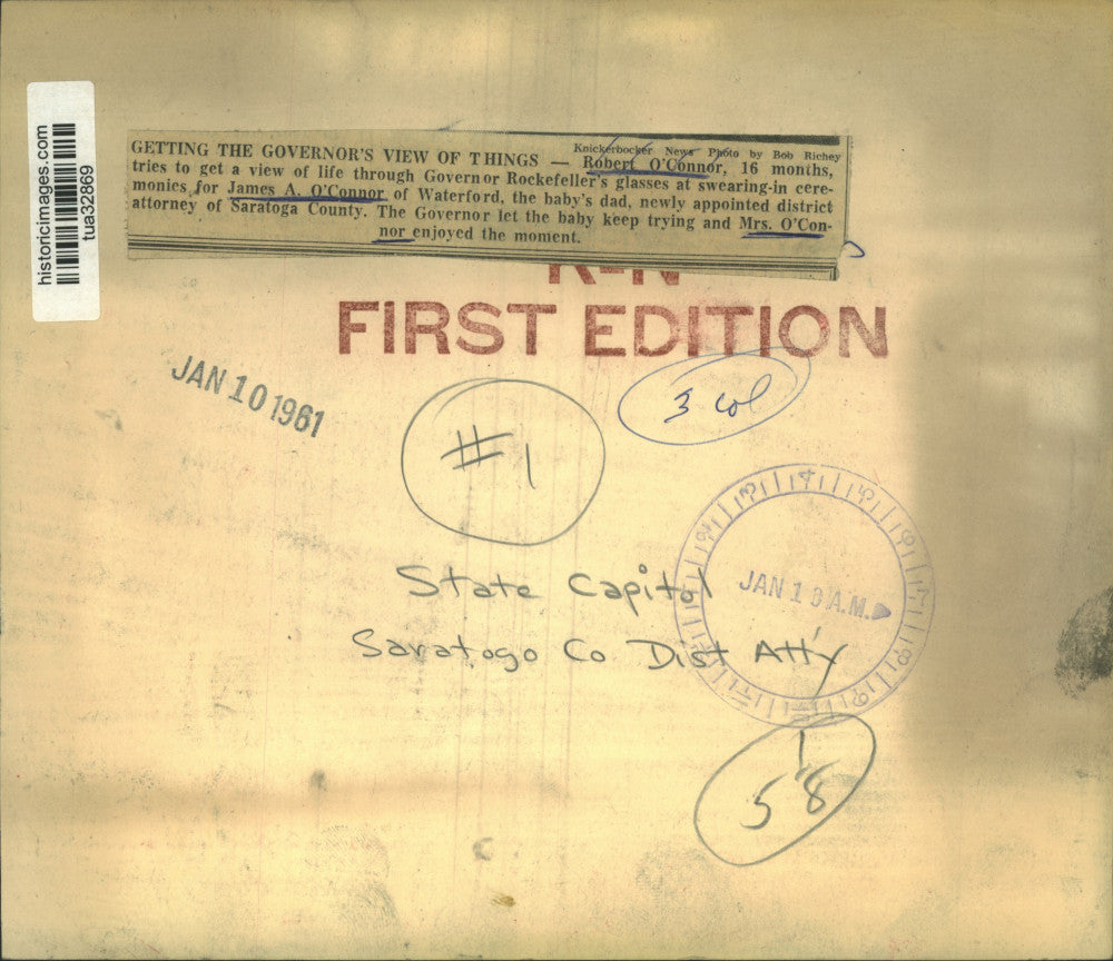 1961 Press Photo Infant tries New York Governor's glasses at ceremony in Albany