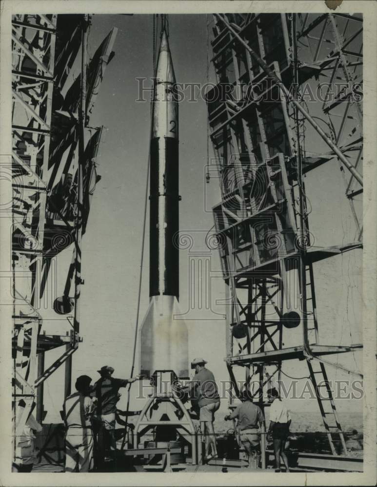 1964 Press Photo Men work at attaching missile to launch pad - tua33842
