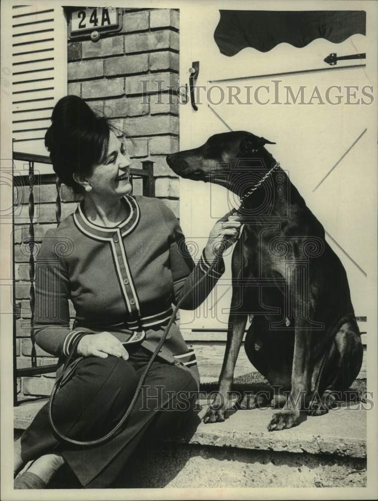 Load image into Gallery viewer, 1975 Press Photo Claire Marshall sits on porch steps with her dog 'black lady'
