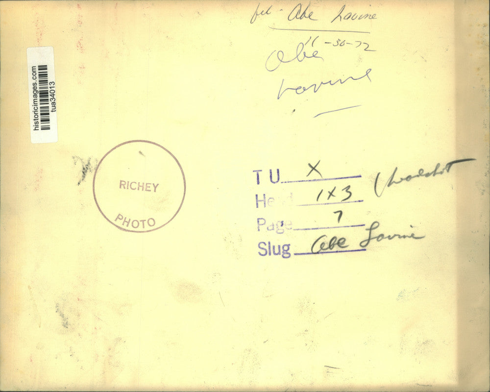 1972 Press Photo Abe Lovine sits at table hold papers in his hand - tua34013