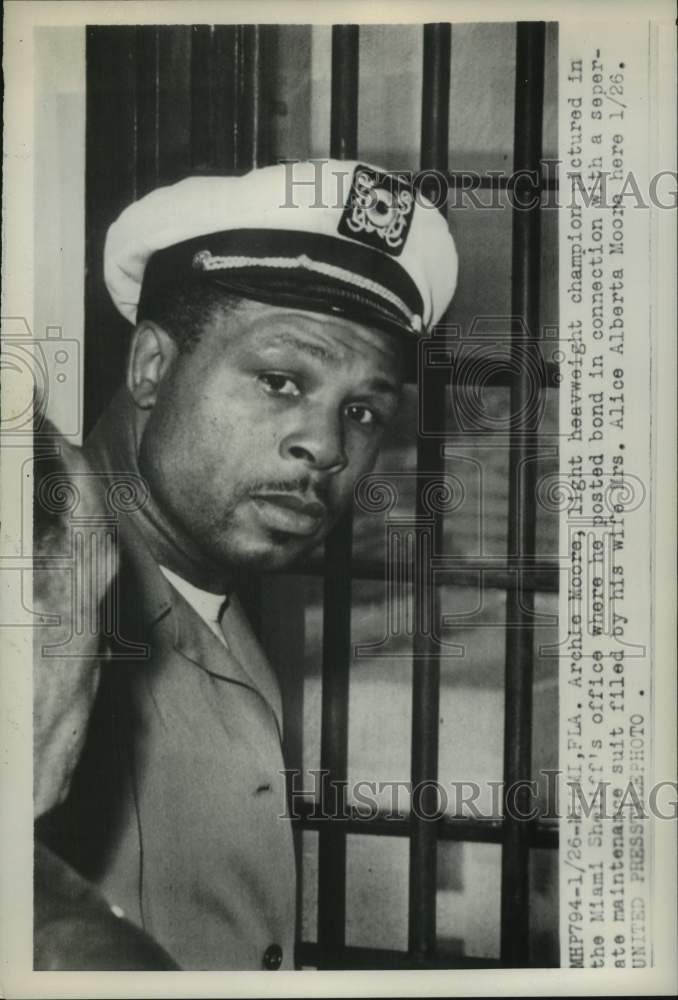 Load image into Gallery viewer, 1954 Press Photo Boxer Archie Moore in Miami, Florida sheriff's office
