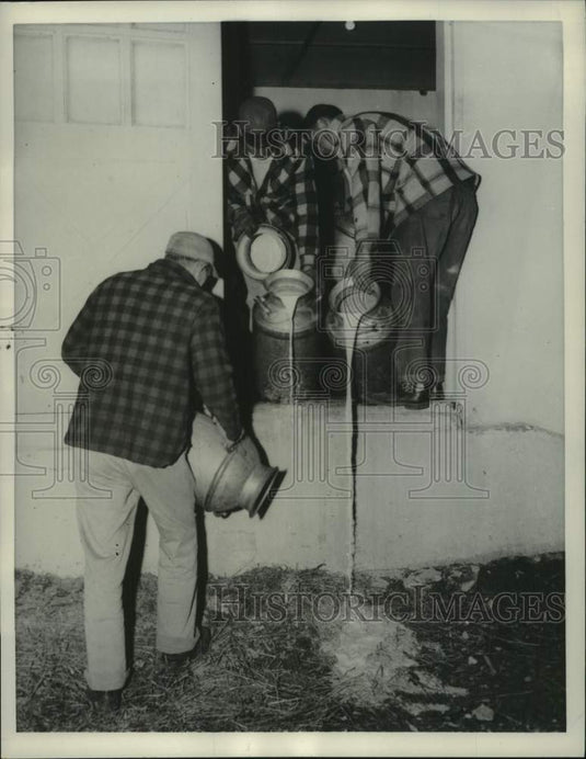1957 Press Photo Dairy farmers dump milk during strike in Northeastern US