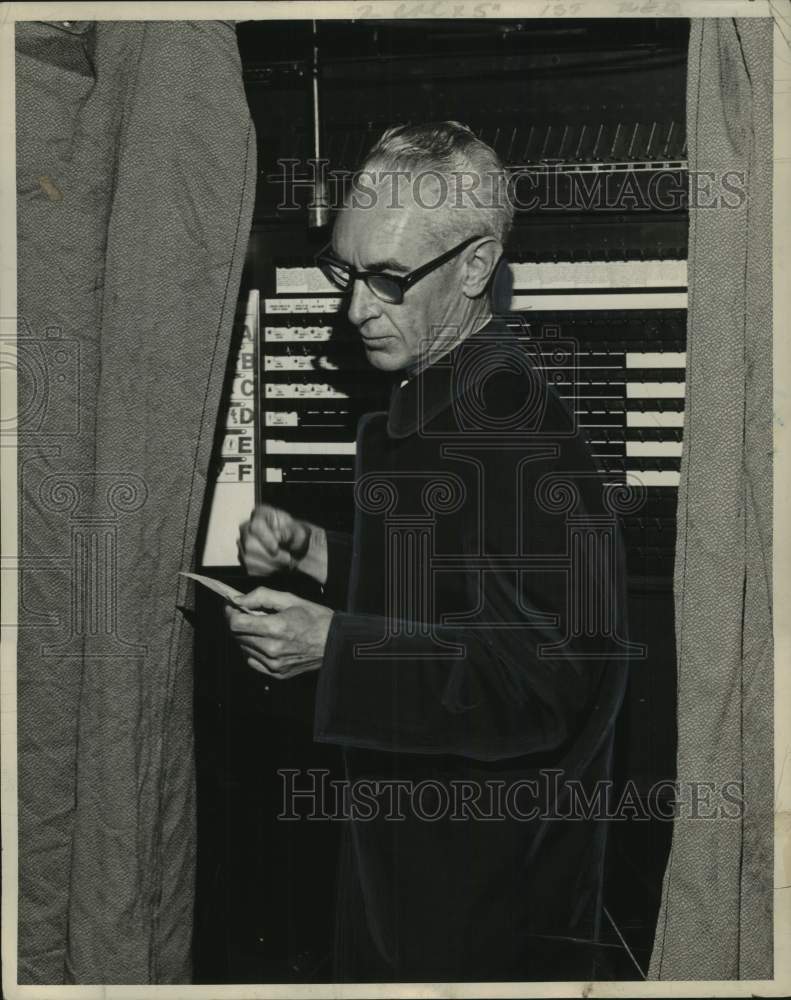 Load image into Gallery viewer, 1965 Press Photo Dr. James E. McDonald, Mayor, Cohoes, New York in voting booth
