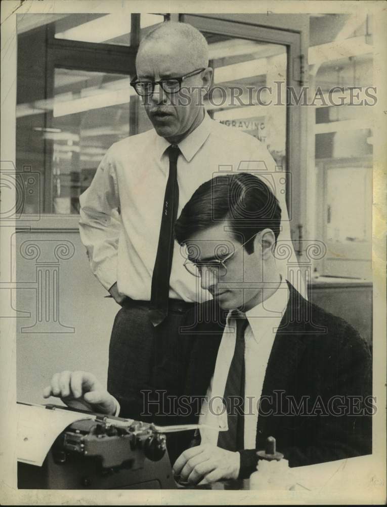 Load image into Gallery viewer, 1968 Press Photo John Gregory &amp; John Maguire, father &amp; son, in New York office
