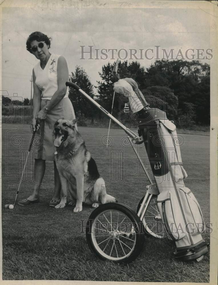 1964 Press Photo Mrs. Edward Jones with dog on New York golf course - tua37722- Historic Images