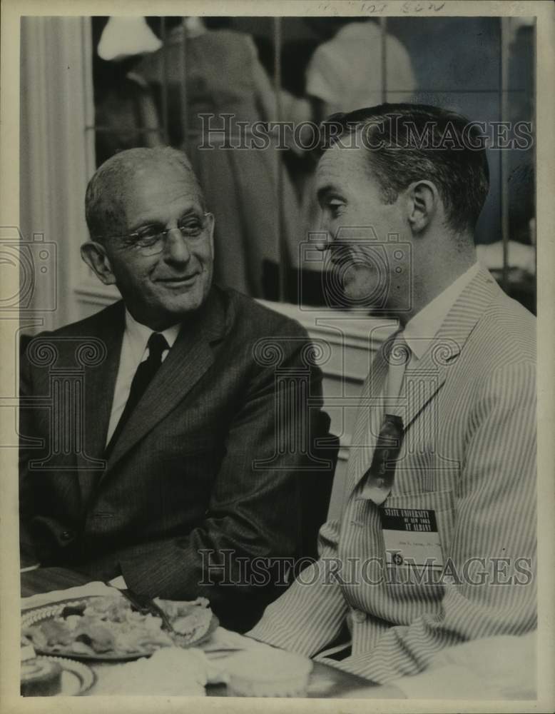 Load image into Gallery viewer, 1964 Press Photo Sam Aronowitz &amp; John Laing chat in Albany, New York - tua39145
