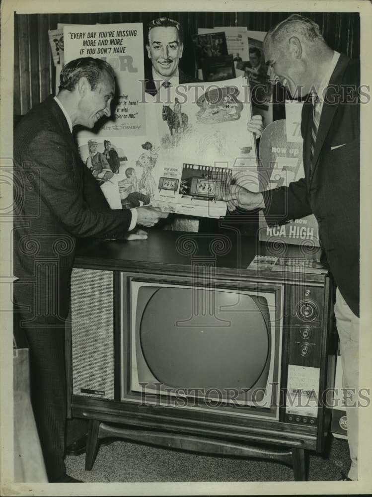 1961 Press Photo Larry Legace & Harold Garilove admire new color TV in New York- Historic Images
