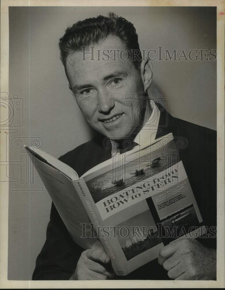 1966 Press Photo James P. Keneally with boating book in New York - tua50471
