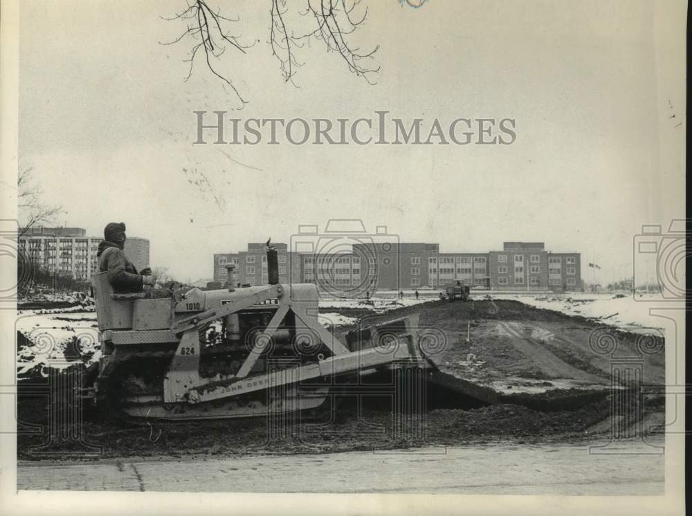 1961 Press Photo Worker on front loader at Albany, New York construction site
