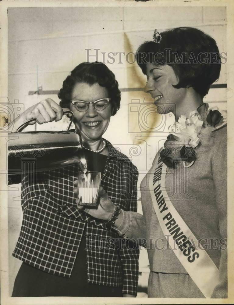 1966 Press Photo Dairy Council official pours milk for New York Dairy Princess