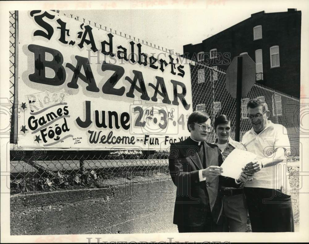 1978 Press Photo Men look over flyer for St. Adalbert's Bazaar in Albany, NY