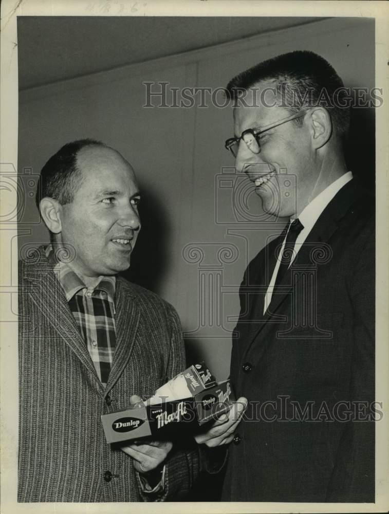 1966 Press Photo Businessmen holding box of Dunlop Maxfli golf balls - tua59160- Historic Images