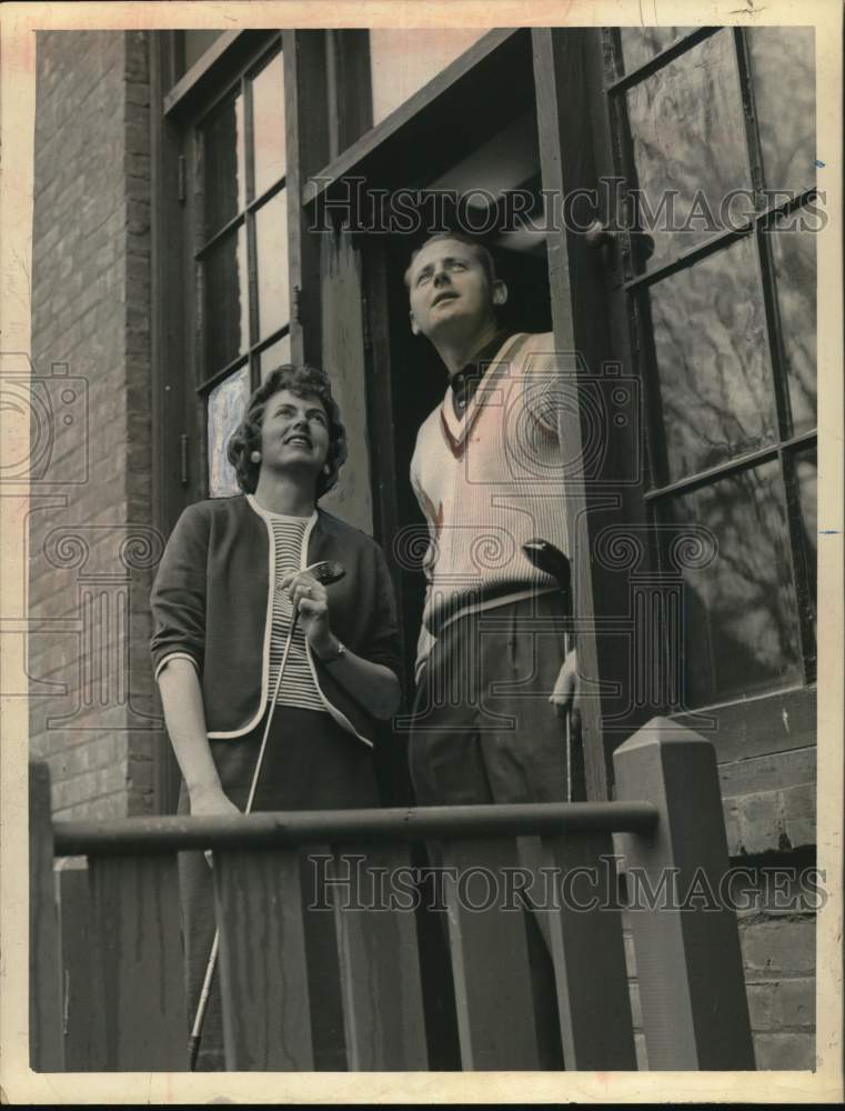 1961 Press Photo Golfers check weather from window at Albany, NY country club- Historic Images