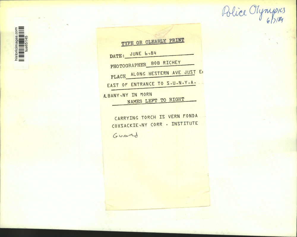 1984 Press Photo Albany, New York police escort torch bearer for Police Olympics